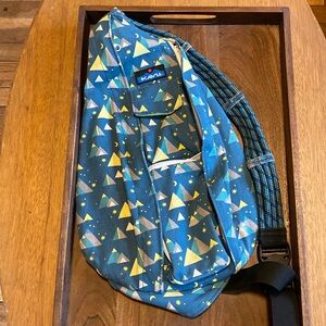 Kavu triangle, crossbody hiking bag.
Mountain scenery with stars, green lining